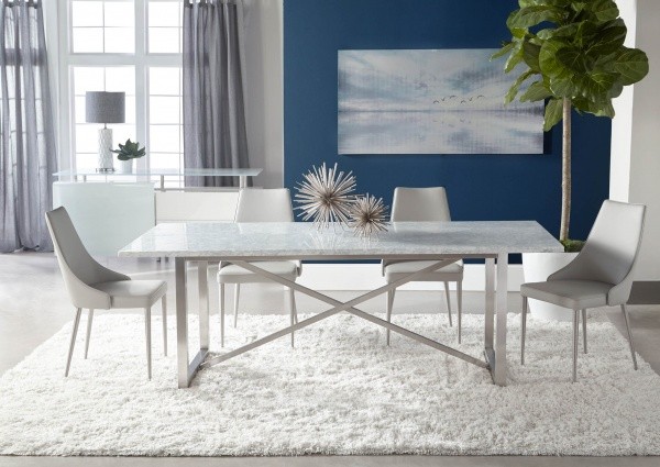 luxury dining room with all white table and four white chairs with white shag rug