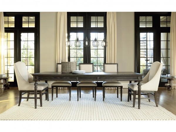 luxury dining room with dark brown table with five cream and wood chairs